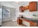 Well-lit laundry room with counter space, cabinets, and laundry sink, perfect for chores at 5006 Sand Trap Ct # 142, Monroe, NC 28112