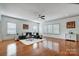 Spacious living room with hardwood floors, neutral decor, and abundant natural light at 5006 Sand Trap Ct # 142, Monroe, NC 28112