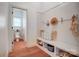 Charming mudroom with built-in bench, storage shelves, and coat hooks at 5006 Sand Trap Ct # 142, Monroe, NC 28112