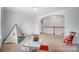 Open playroom area featuring a small tent, toys, and carpeted floor at 5006 Sand Trap Ct # 142, Monroe, NC 28112