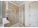 Elegant tiled shower with glass door and built-in shelves, providing a spa-like experience at 5006 Sand Trap Ct # 142, Monroe, NC 28112