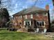 Brick home with a patio deck, outdoor seating, and green lawn at 6301 Royal Aberdeen Ct, Charlotte, NC 28277