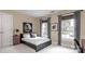Well-lit bedroom featuring a decorative skull pillow and playful Star Wars artwork at 6301 Royal Aberdeen Ct, Charlotte, NC 28277