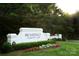 Providence Country Club entrance with manicured lawn and colorful flower beds at 6301 Royal Aberdeen Ct, Charlotte, NC 28277