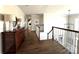Second floor hallway featuring hardwood floors, and views into other rooms at 6301 Royal Aberdeen Ct, Charlotte, NC 28277