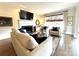 Cozy living room showcasing a fireplace, hardwood flooring, and neutral tones at 6301 Royal Aberdeen Ct, Charlotte, NC 28277