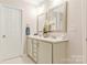 Bright bathroom featuring a double vanity with decorative mirrors and a neutral color palette at 733 Rocky Grove Gln, York, SC 29745