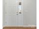 Bright entryway featuring white six panel door with half light and wood-look laminate flooring at 733 Rocky Grove Gln, York, SC 29745