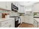 Modern kitchen featuring stainless appliances, white cabinets, quartz counters, and modern hardware at 733 Rocky Grove Gln, York, SC 29745