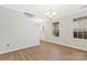 Bright, neutral living room featuring laminate floors, a white staircase, and a chandelier at 733 Rocky Grove Gln, York, SC 29745
