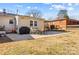 Backyard features patio with grill and seating, and well-maintained lawn at 754 Edgemoor Dr, Mooresville, NC 28115