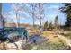 Spacious backyard featuring a wooden deck, wooded view, and open green space at 7732 Wingmont Dr, Charlotte, NC 28269