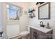 Well-lit bathroom featuring shiplap walls, a vanity with modern fixtures, and a toilet at 7732 Wingmont Dr, Charlotte, NC 28269