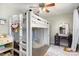 A cute bedroom with a high lofted bed, a desk, and a vanity at 7732 Wingmont Dr, Charlotte, NC 28269