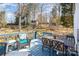 Relaxing outdoor deck with comfortable seating and a serene backyard view and wooded view at 7732 Wingmont Dr, Charlotte, NC 28269