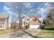 Attractive two-story home features a brick and siding exterior, an attached garage, and a well-maintained front yard at 7732 Wingmont Dr, Charlotte, NC 28269