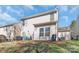 This backyard features a patio with outdoor seating, a satellite dish, and a lawn at 8028 Tricia Pointe Pl, Indian Land, SC 29707