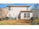 This backyard features a patio with outdoor seating, a satellite dish, and a lawn at 8028 Tricia Pointe Pl, Indian Land, SC 29707