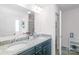 Bathroom with a double sink vanity featuring granite countertops, framed mirror and vanity at 8028 Tricia Pointe Pl, Indian Land, SC 29707