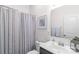 Cozy bathroom featuring a toilet, shower with striped curtain, framed art, and vanity with marble countertop at 8028 Tricia Pointe Pl, Indian Land, SC 29707