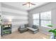 Cozy bedroom with carpet floors, natural light, and a corner sofa for a relaxing atmosphere at 8028 Tricia Pointe Pl, Indian Land, SC 29707