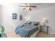 This cozy bedroom features neutral walls and flooring, a ceiling fan, and modern decor at 8028 Tricia Pointe Pl, Indian Land, SC 29707