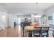 Open-concept dining area connecting to a modern kitchen, ideal for Gathering gatherings and entertaining at 8028 Tricia Pointe Pl, Indian Land, SC 29707