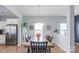 Elegant dining room with a large table, modern lighting, and ample space for Gathering gatherings at 8028 Tricia Pointe Pl, Indian Land, SC 29707