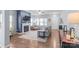 Spacious living room features a fireplace, large windows, and stylish furnishings, ideal for entertaining at 8028 Tricia Pointe Pl, Indian Land, SC 29707