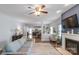 Inviting living room with hardwood floors and a decorative fireplace leading into a spacious kitchen at 8028 Tricia Pointe Pl, Indian Land, SC 29707