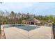 Community pool and pool house surrounded by picnic tables and ample seating at 8028 Tricia Pointe Pl, Indian Land, SC 29707