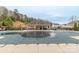 Community pool and pool house surrounded by picnic tables and ample seating at 8028 Tricia Pointe Pl, Indian Land, SC 29707