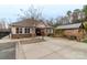 Community pool house with picnic tables, an outdoor grilling area, and ample seating at 8028 Tricia Pointe Pl, Indian Land, SC 29707