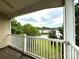 Balcony view of the pool and lush green surroundings at 8668 Coralbell Ln # 10, Charlotte, NC 28213