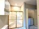 Bathroom featuring a shower, cabinets, and a laundry area at 8668 Coralbell Ln # 10, Charlotte, NC 28213