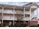 Charming three-story condo featuring private balconies and well-maintained landscaping at 8668 Coralbell Ln # 10, Charlotte, NC 28213