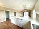 A kitchen featuring white cabinets and stainless steel dishwasher with an open-concept design at 8668 Coralbell Ln # 10, Charlotte, NC 28213