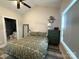 Serene bedroom with ceiling fan, neutral paint, and lots of natural light at 8668 Coralbell Ln # 10, Charlotte, NC 28213