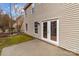 Exterior view of the home featuring a patio and access to the backyard at 9014 Arbor Creek Dr, Charlotte, NC 28269
