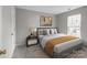 Comfortable bedroom with a large window, accent lighting, and stylish decor at 9014 Arbor Creek Dr, Charlotte, NC 28269