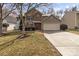 Charming two-story home with a two-car garage, brick accents and a well-manicured lawn at 9014 Arbor Creek Dr, Charlotte, NC 28269