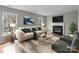Cozy living room with modern decor, fireplace, and large windows at 9014 Arbor Creek Dr, Charlotte, NC 28269