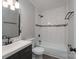 Bathroom with a shower-tub combination with black fixtures and a dark vanity at 910 Mcdow Dr, Rock Hill, SC 29732
