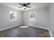Bedroom with hardwood floors, two windows, and a ceiling fan at 910 Mcdow Dr, Rock Hill, SC 29732