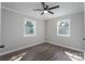 Bedroom with hardwood floors, neutral paint, ceiling fan, and bright windows at 910 Mcdow Dr, Rock Hill, SC 29732