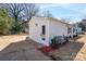 Side view of the home showcasing the vinyl siding, outdoor space, and detached garage at 910 Mcdow Dr, Rock Hill, SC 29732