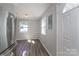 View into the kitchen featuring stainless steel appliances, white cabinets, and updated fixtures at 910 Mcdow Dr, Rock Hill, SC 29732