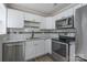 Bright kitchen with white cabinets, stainless steel appliances, and granite countertops at 910 Mcdow Dr, Rock Hill, SC 29732