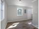 Living area featuring new laminate floors, fresh paint, and a window letting in natural light at 910 Mcdow Dr, Rock Hill, SC 29732