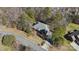 Aerial view of house surrounded by mature trees and long driveway at 10620 S Ford Rd, Charlotte, NC 28214